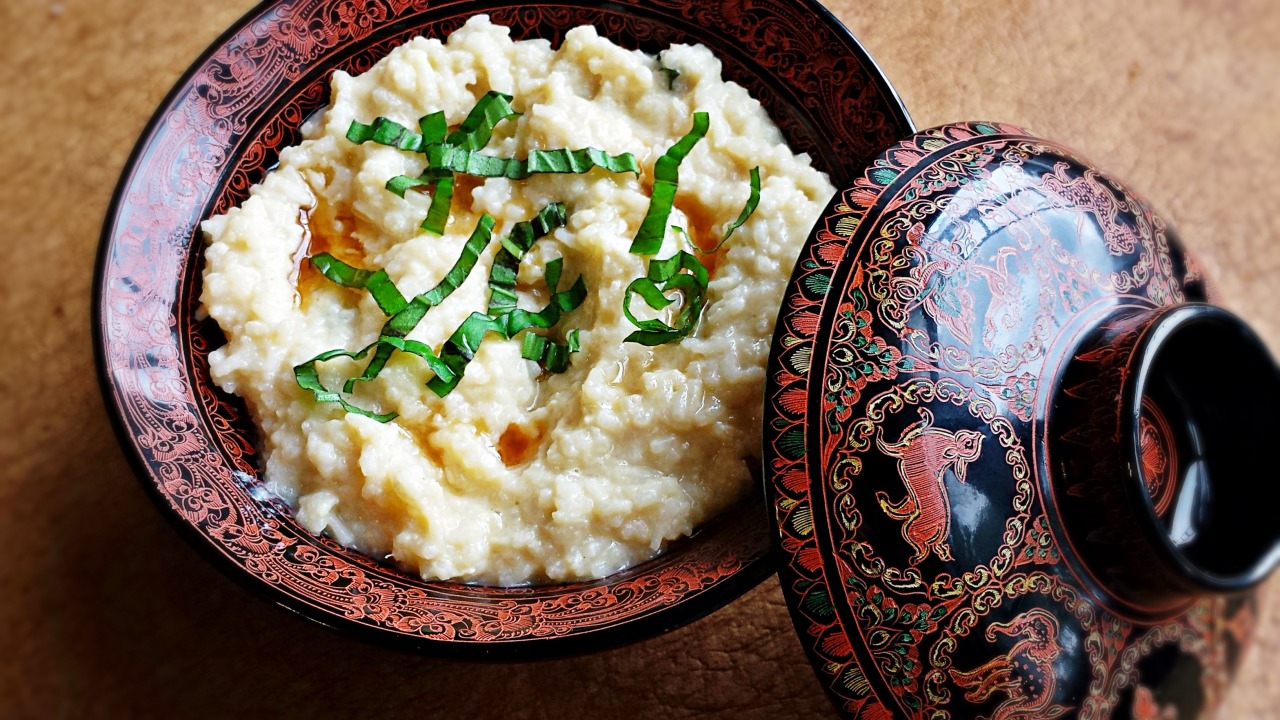 Garnished rice porridge in a bowl