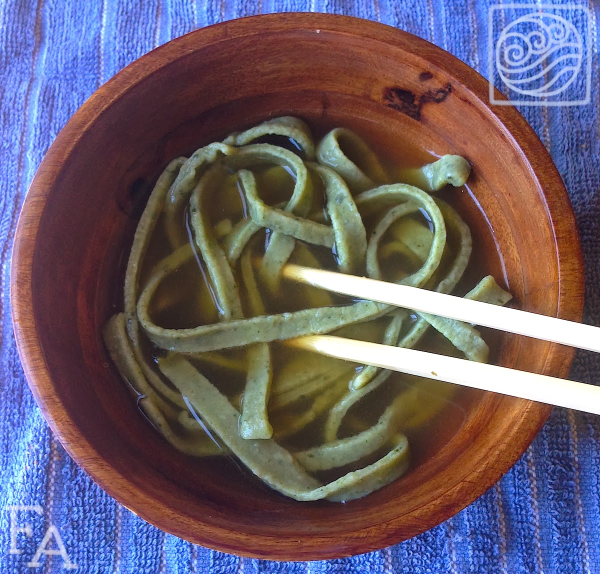 A bowl of seaweed noodles in broth